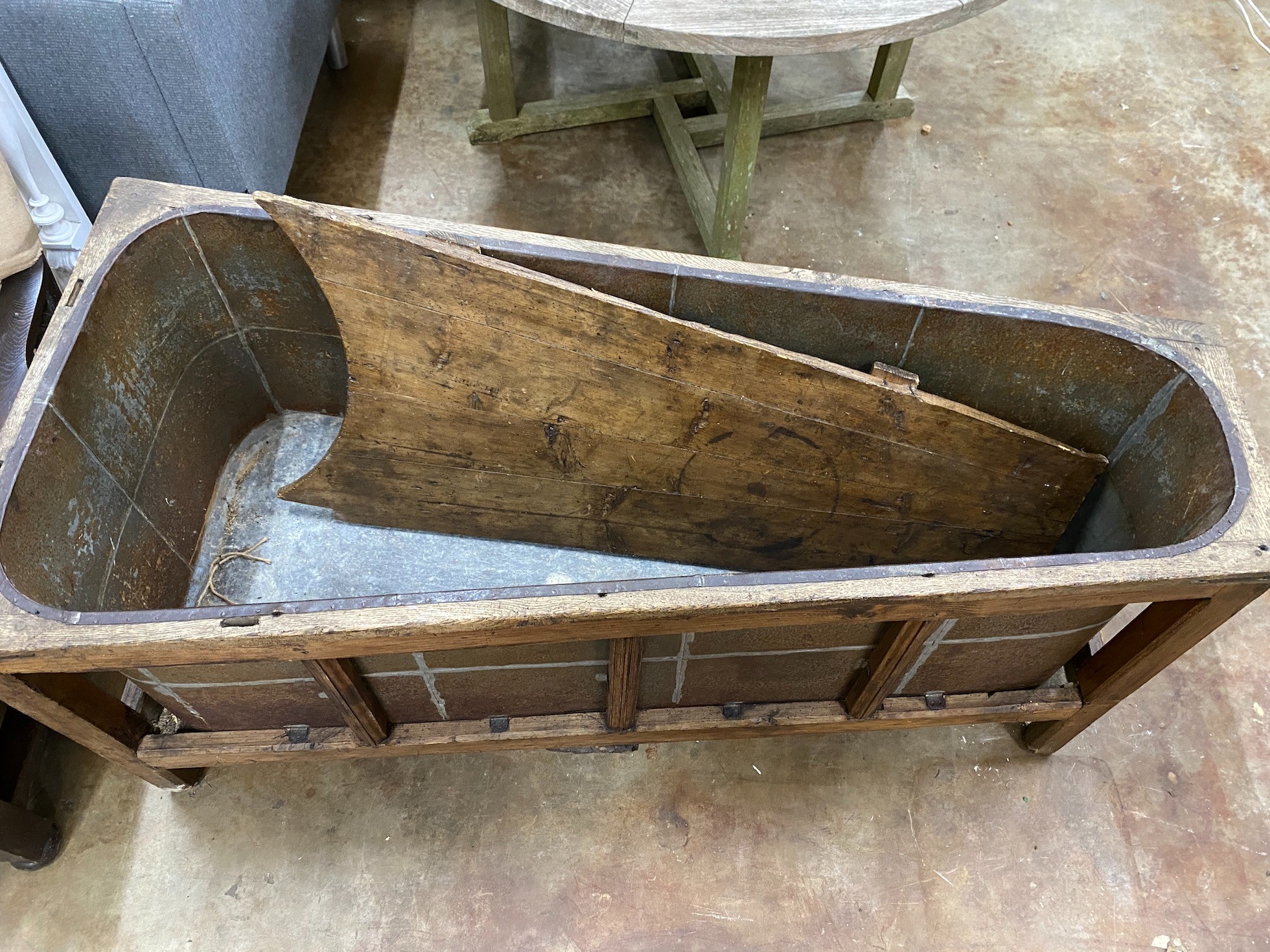 A 19th century French oak bath with zinc liner and cover, length 142cm, depth 65cm, height 64cm *Please note the sale commences at 9am.